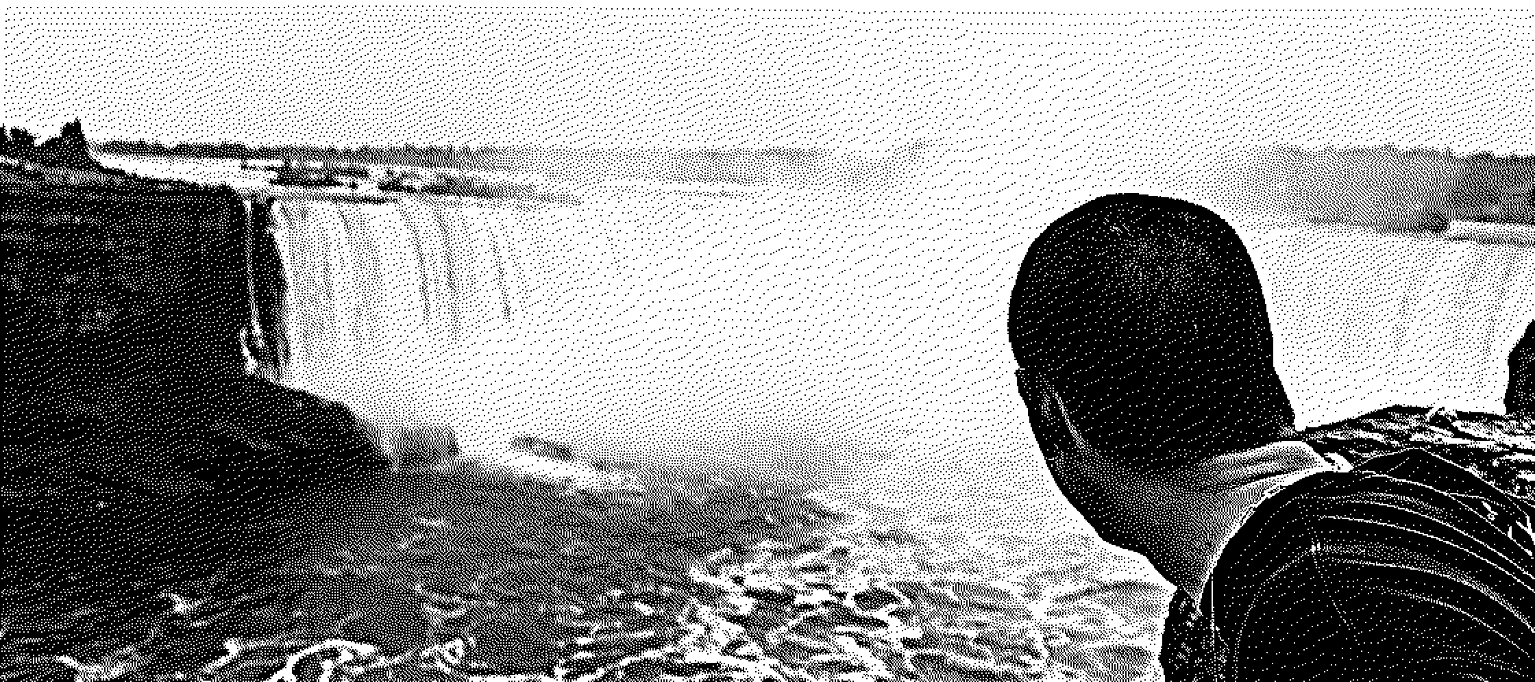 A visitor leans out over the brink of Horseshoe Falls