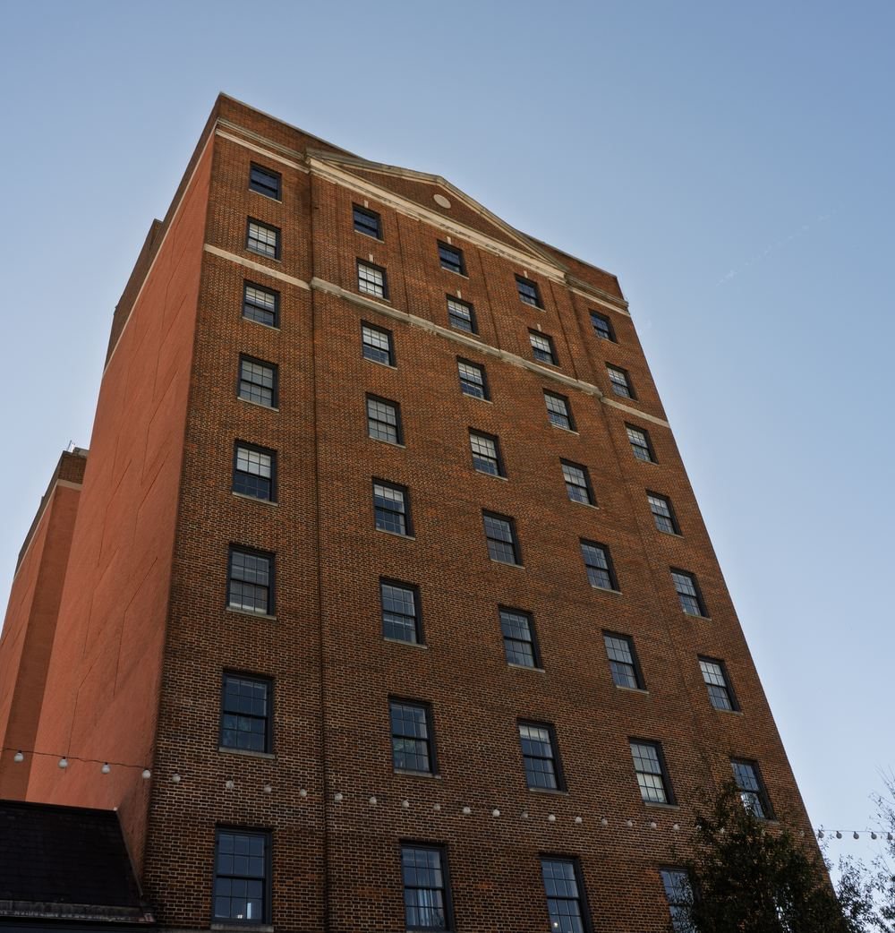 A brick tower photographed from below